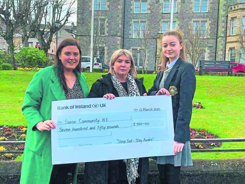 Liadhan McCourt. from the Simon Community  receives a cheque from Zara Schlindwein and Lizzie Ream Diocesan Youth Co-ordinator.
