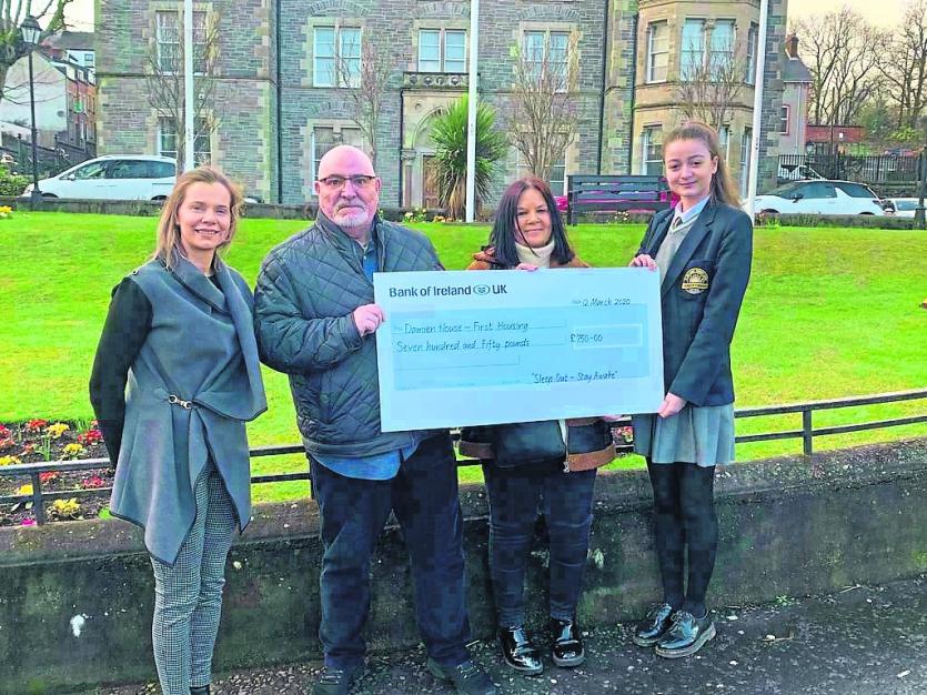 Lexie Doherty and Margaret Brown from Damian House receive a cheque from Lumen Christi student Zara Schlindwein who was one of the organisers of the s