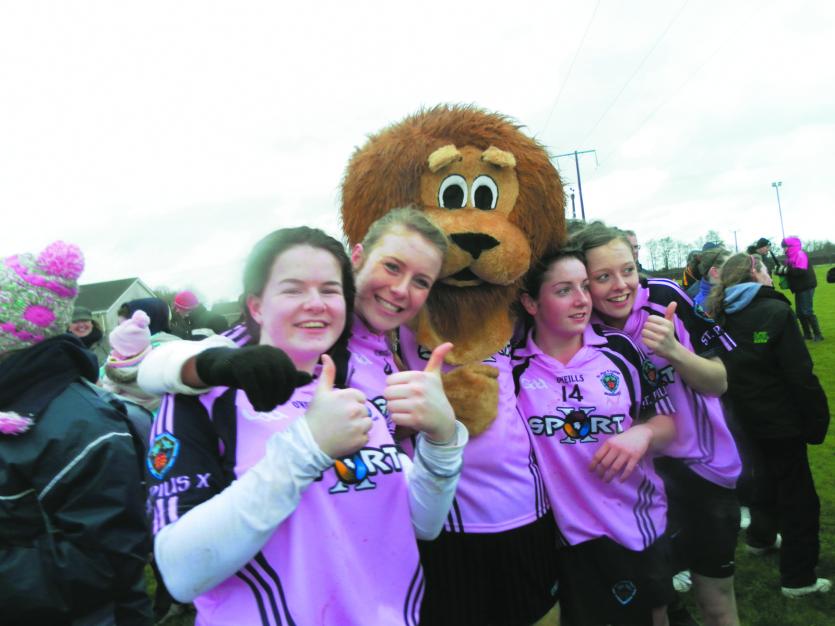 The famous St Pius' lion with members of the 2011 Ulster winning camogie side