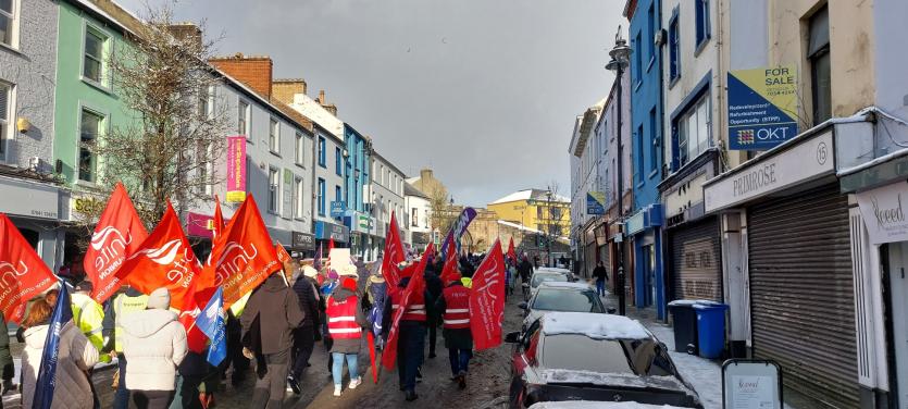 Workers marched down Carlisle Road towards the Guildhall Square Rally
