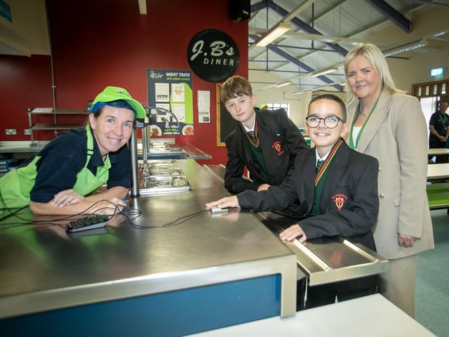THUMBS UP FOR DINNER!. . . .Two of the young Year 8 starts at St. Joseph's Boys School pictured on Friday morning signing in for the canteen. (Photos: Jim McCafferty Photography)