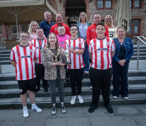 The Mayor of Derry City and Strabane District Council, Grace Ui Niallais pictured at the Guildhall on Tuesday afternoon with the Derry City FC Down Syndrome Futsal team who won the recent League of Ireland Annual Cairdeas Cup in Dublin. The Mayor held a reception for the team in recognition of their fantastic achievement. From left are Keigan Taylor, Eoin McGarry, Zain Attia, Aodhan Collins and Danny Miller. At back are coaches Noel Crampsey and Joe Kelly. (Photos: Jim McCafferty Photography)