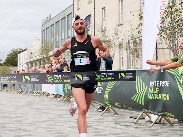 Waterside Half Marathon winner, Stephen McAuley crosses the finish line.
