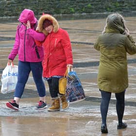 People in Guildhall Square during a previous storm. DER0220GS – 007