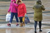 People in Guildhall Square during a previous storm. DER0220GS – 007