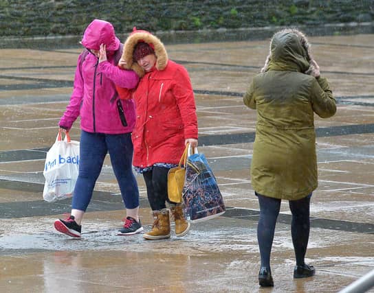 People in Guildhall Square during a previous storm. DER0220GS – 007