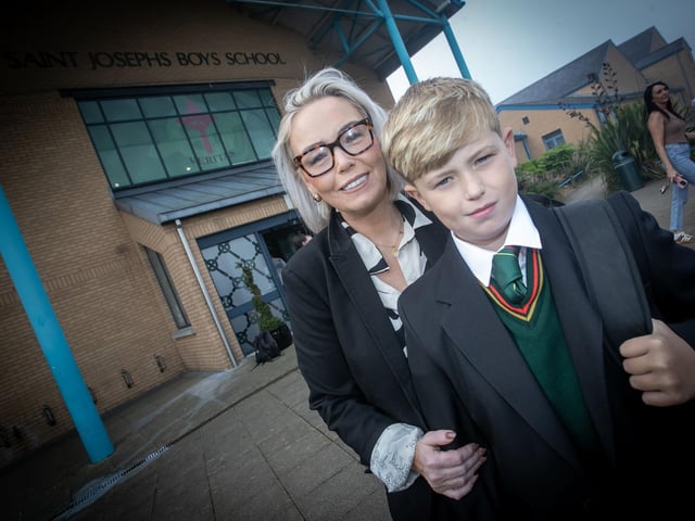 Year 8 student Reuben Harkin pictured with his mum Marie on his first day at St. Joseph's on Friday last. (Photos: Jim McCafferty Photography)