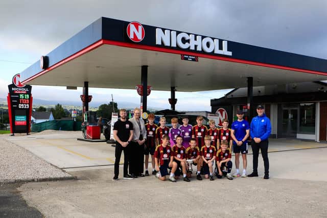 Nicholl (Fuel Oils) Ltd. representatives, Margaret Gallagher, director retail, and Dale Simpson, administrator supervisor with Culmore FC U12 team winners of the O’Neills Foyle Cup Rosebowl as Nicholl Oils celebrates opening of New Auto 365 Forecourt, Culmore Road. Included on right, are Uel Watson, and Fountain O’Flynn, coaches. (Photo - Tom Heaney, nwpresspics)