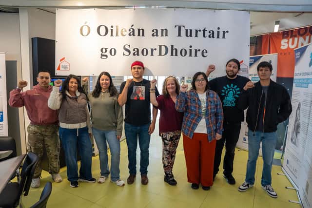 Director of the Bloody Sunday Trust Maeve McLaughlin (fourth from right) with an indigenous delegation who travelled to the city for Derry Peace and Conflict International (DCPI) week. Included are Krystal Two Bulls (third from left), Rafael 'Tufawon' Gonzalez Jr. (far left) alongside Lynette Two Bulls, Cheyenna 'Chey' Morgan, Joseph White Eyes, Big Wind Carpenter and Mato White Plume. The banner in the Museum of Free Derry reads Ó Oileán an Turtair go Saor Dhoire (From Turtle Island to Free Derry) in deference to a term used by many indigenous peoples to refer to the North American continent.