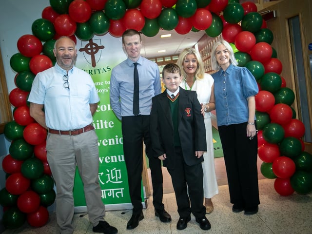 Principal Mrs. Ciara Deane and staff members pose for a photo with new Year 8 student Daniel Morrow on Friday morning. (Photos: Jim McCafferty Photography)