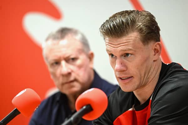 James McClean, right, and Chairman Philip O’Doherty during the former Ireland international's signing earlier this year.