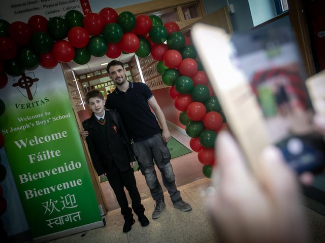 Best of luck son. . . . .Father and son pose for a picture at St. Joseph's on Friday morning. (Photos: Jim McCafferty Photography)