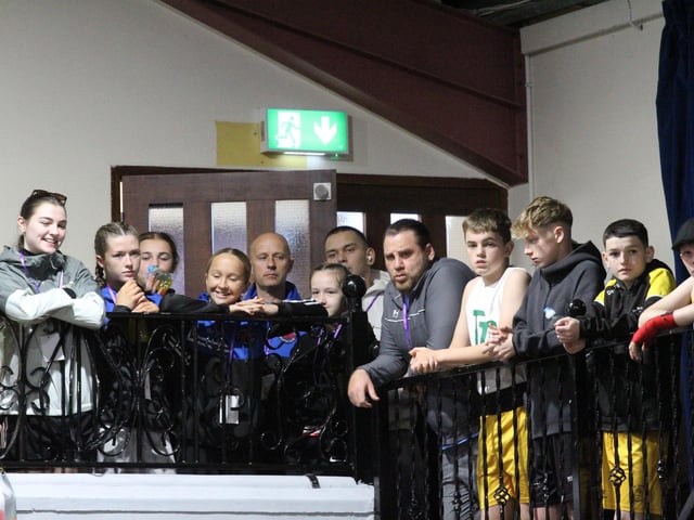 Spectators and boxers watch the action from the balcony at Clonmany ABC.
