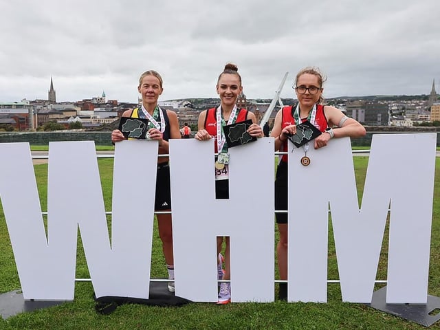 Judith Storm, 1st lady home in the Waterside Half Marathon, with on left, Clare McGuigan, 2nd, and on right, Sarah Kelly, third.